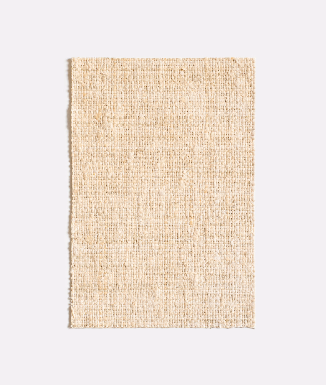 Warm ivory woven swatch with fine slubs and subtly uneven vertical texture