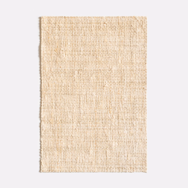 Warm ivory woven swatch with fine slubs and subtly uneven vertical texture