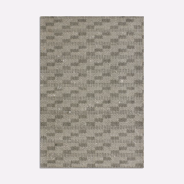 Ash-grey woven fabric with small staggered geometric marks and mottled charcoal texture