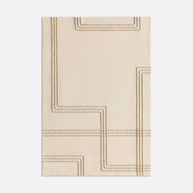 Pale ivory fabric with taupe stepped geometric lines and subtle woven texture