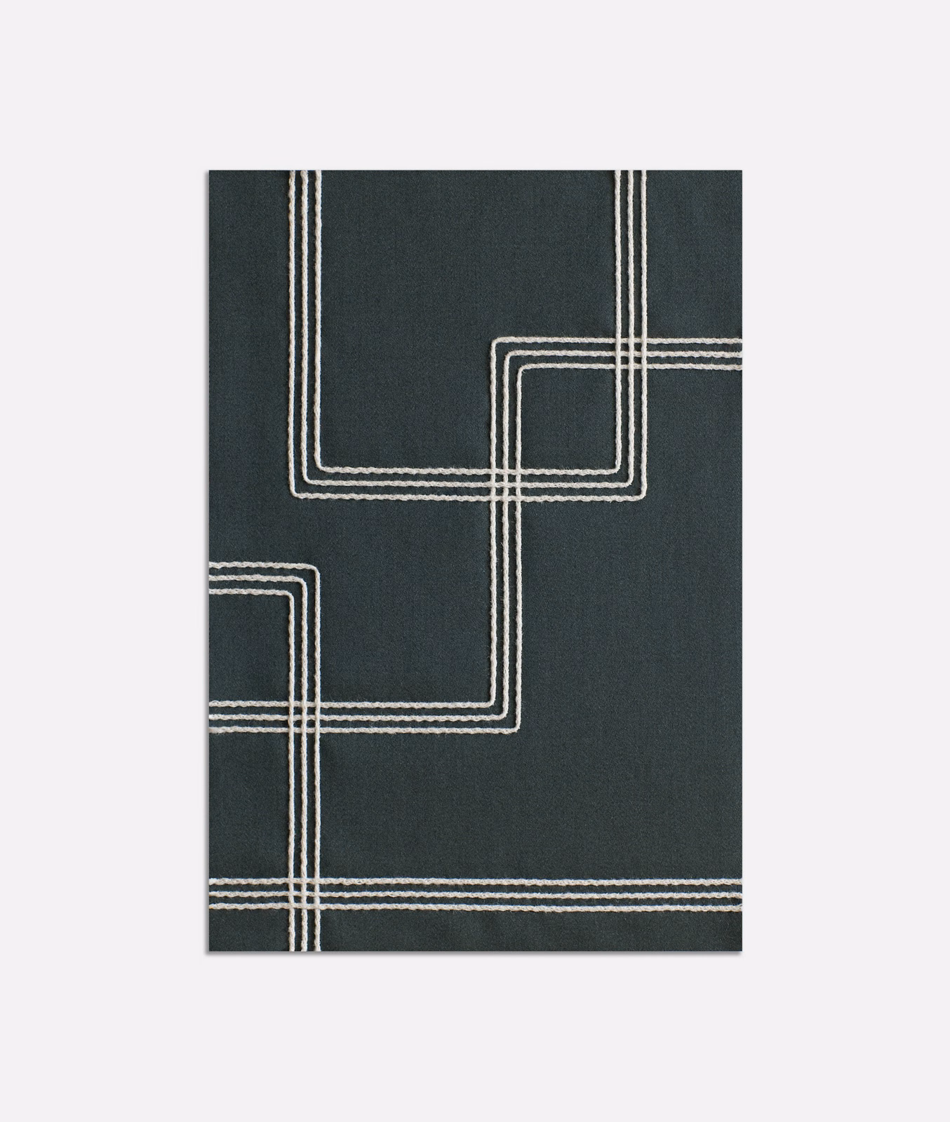 Deep petrol blue-green textile with ivory parallel lines forming rounded geometric corners