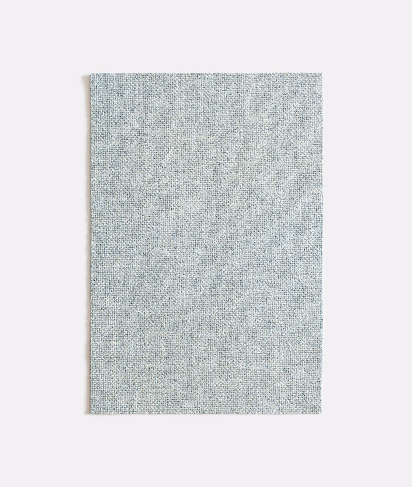 Pale aqua-blue woven fabric swatch with fine mottled texture and softly varied surface