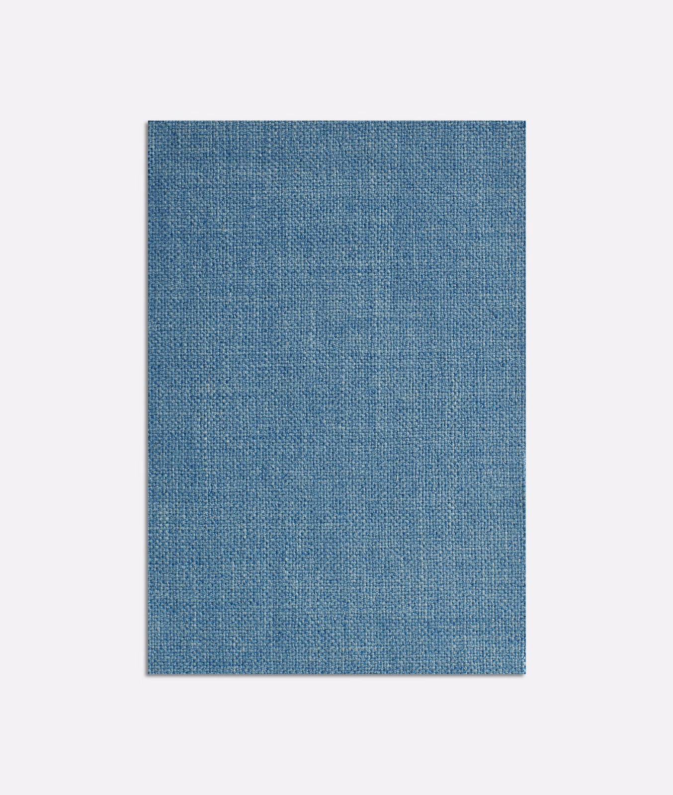 Cool denim-blue plain weave with subtle vertical tonal variation and fine crosshatch texture