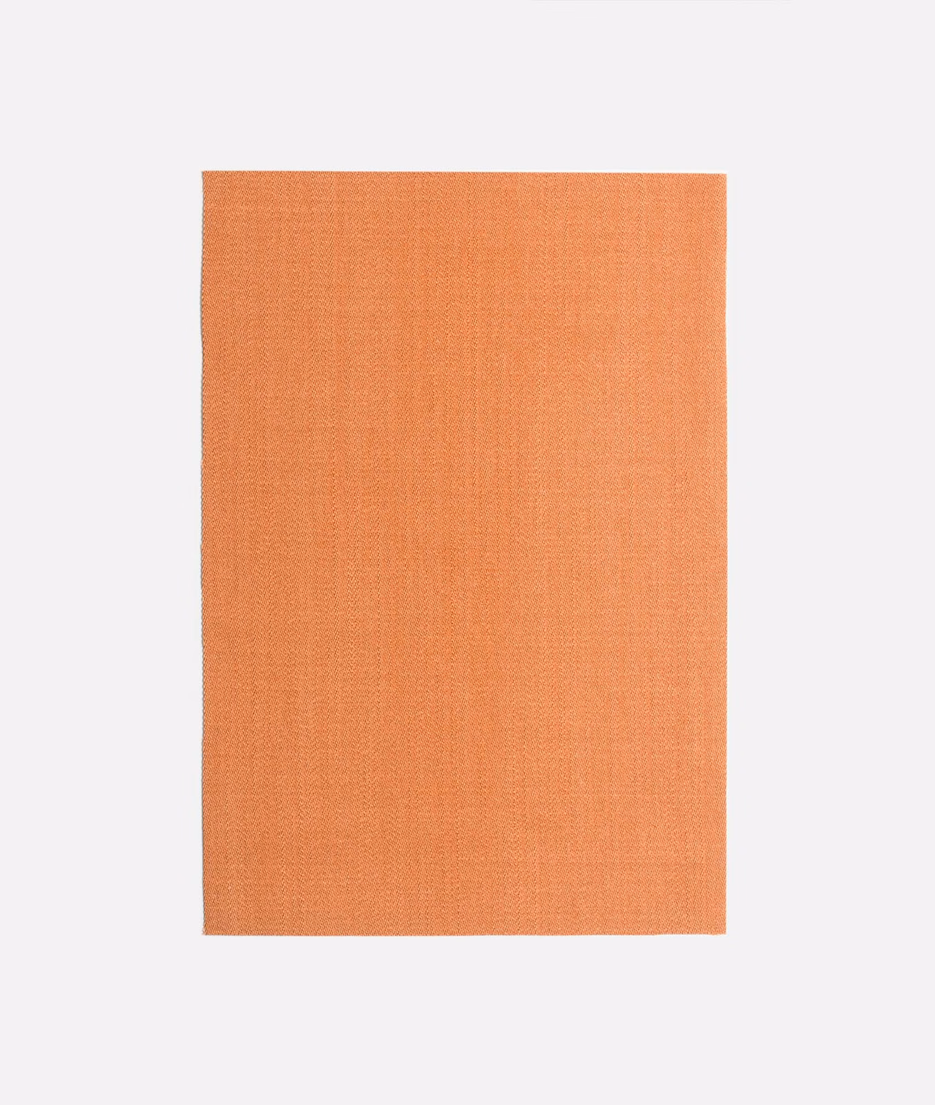 Warm coral-orange plain-weave fabric swatch with a softly textured matte surface