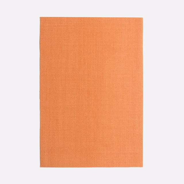 Warm coral-orange plain-weave fabric swatch with a softly textured matte surface