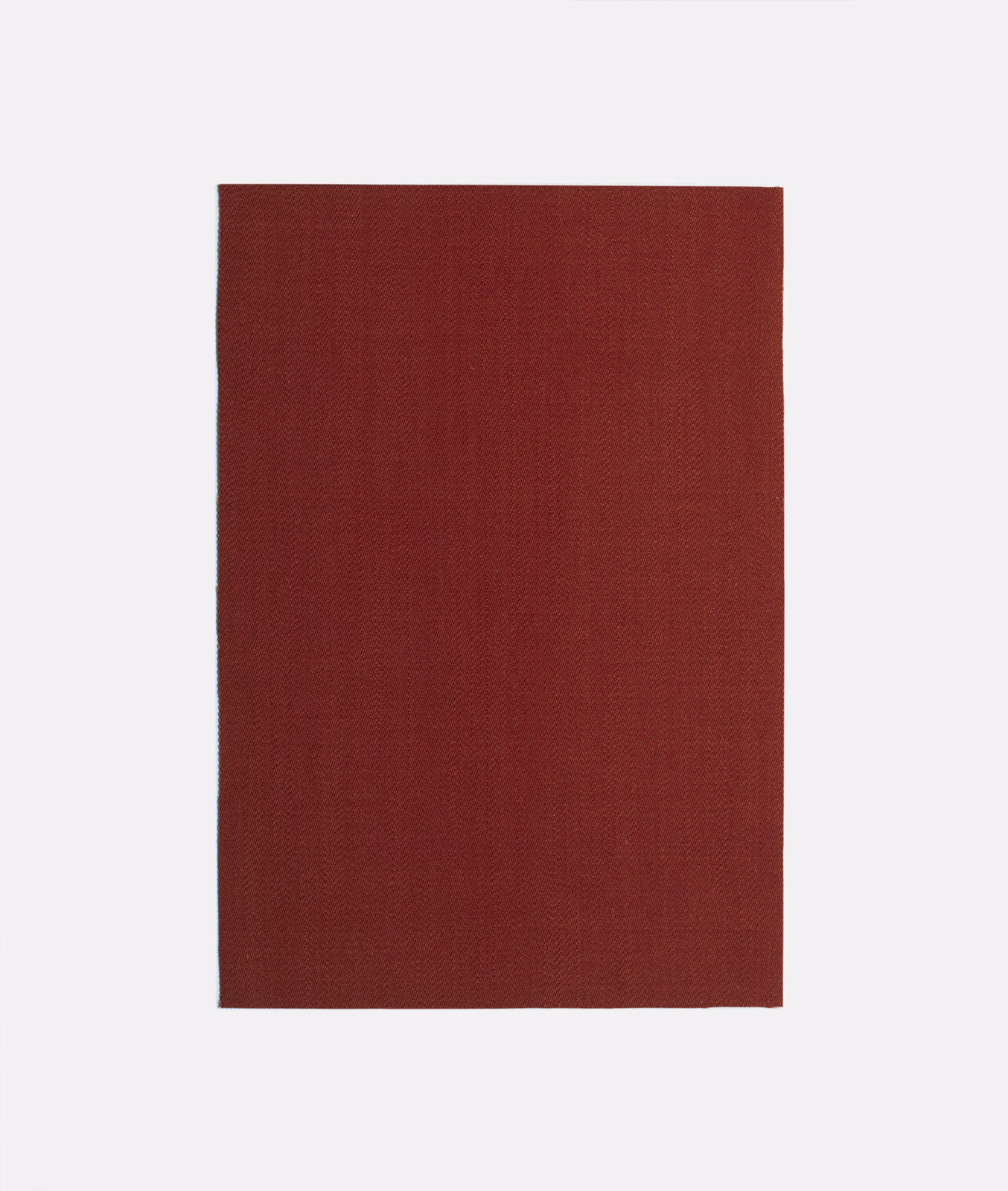 Deep Bordeaux-red plain woven curtain fabric showing a fine crosshatched texture
