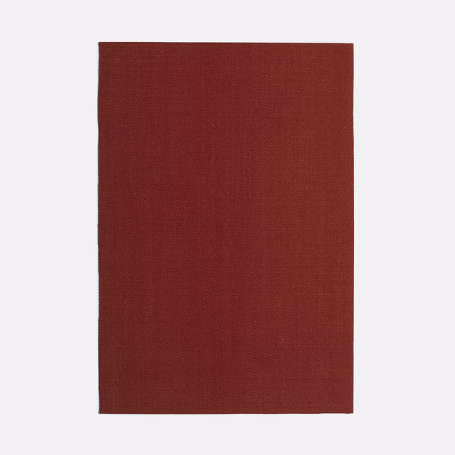 Deep Bordeaux-red plain woven curtain fabric showing a fine crosshatched texture
