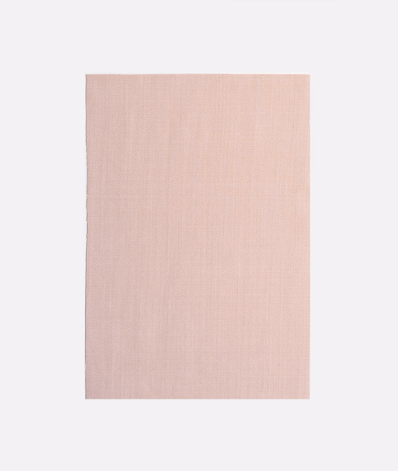 Pale dusty blush pink curtain fabric with a fine vertical woven texture