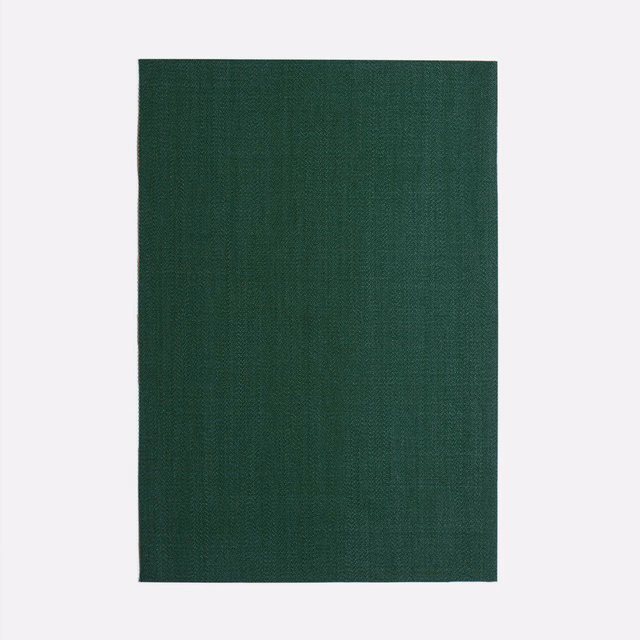 Deep forest-green woven curtain cloth with subtle crosshatch texture and tonal depth