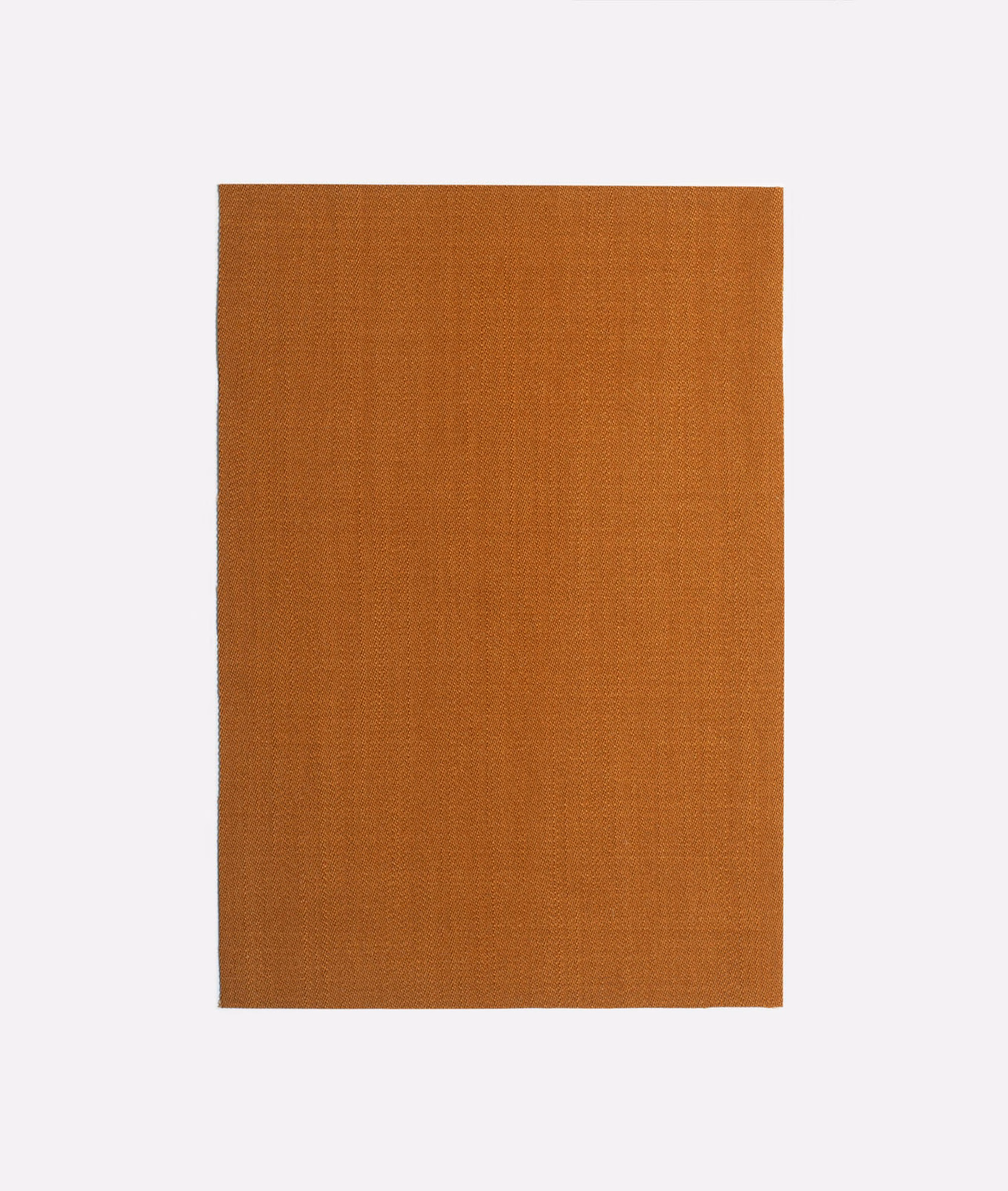 Warm tobacco-brown plain woven fabric swatch with fine, subtly textured surface