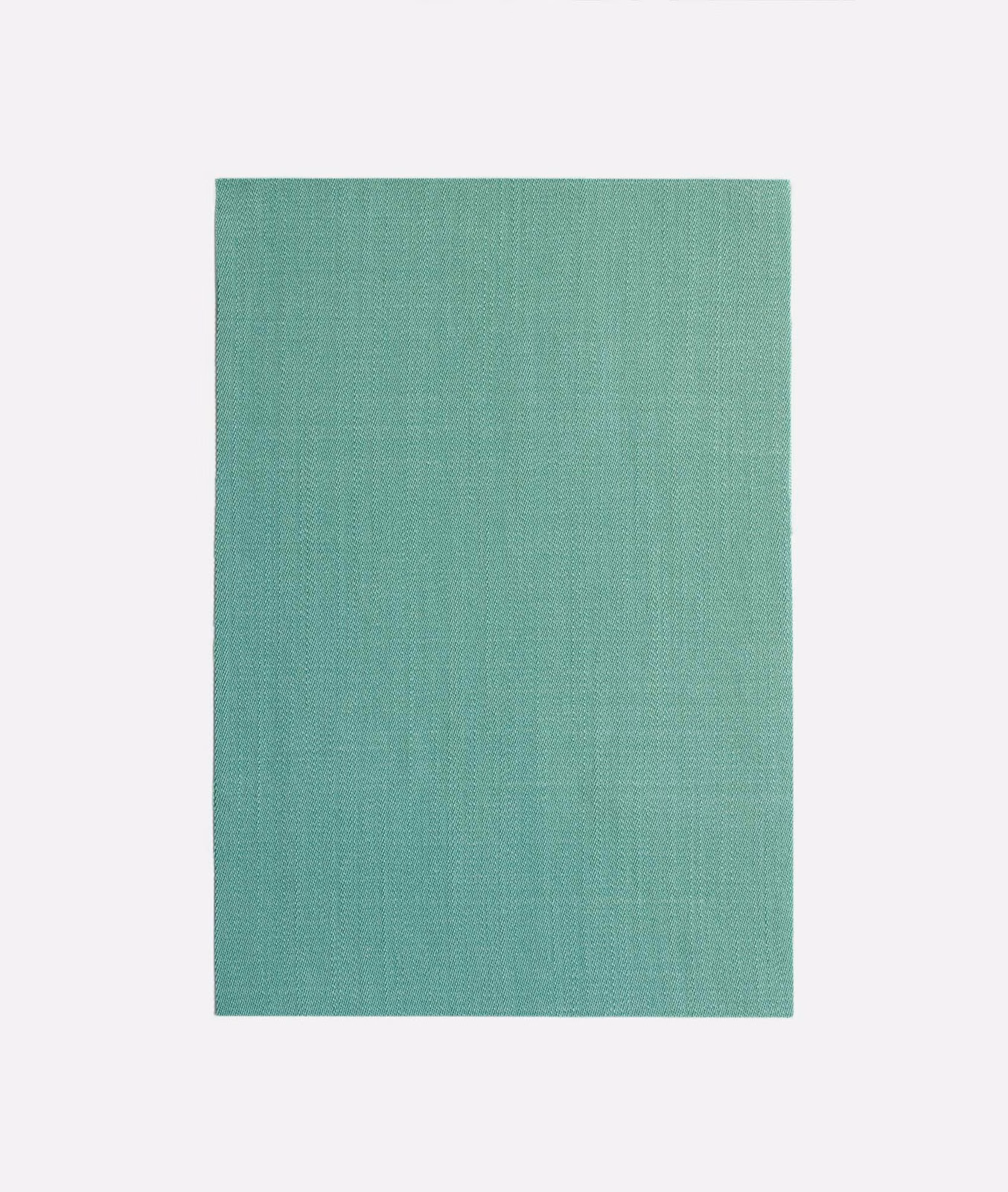 Cool turquoise-teal curtain cloth with a fine vertical woven texture