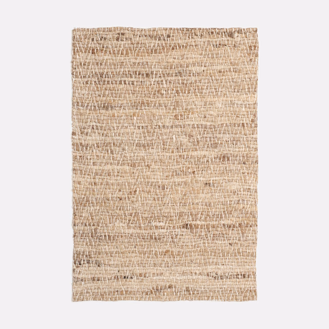 Warm beige Nevio Naturale swatch with an open, irregular slubby weave