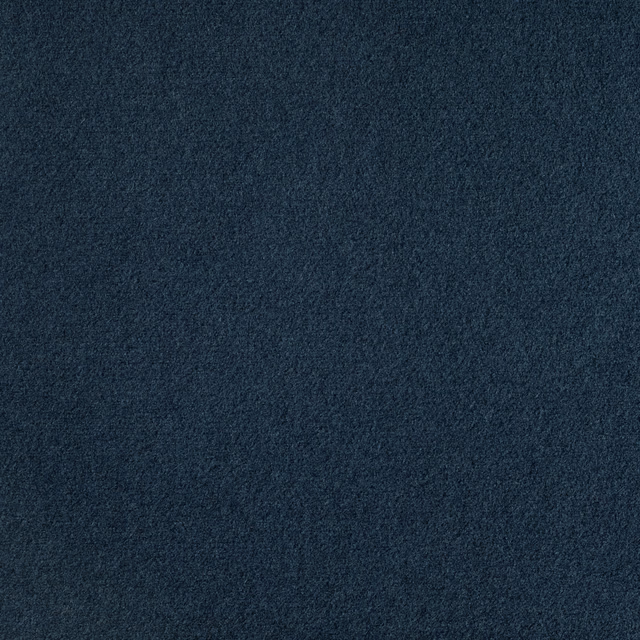Close-up of dark indigo cloth with a subtly mottled, softly textured surface