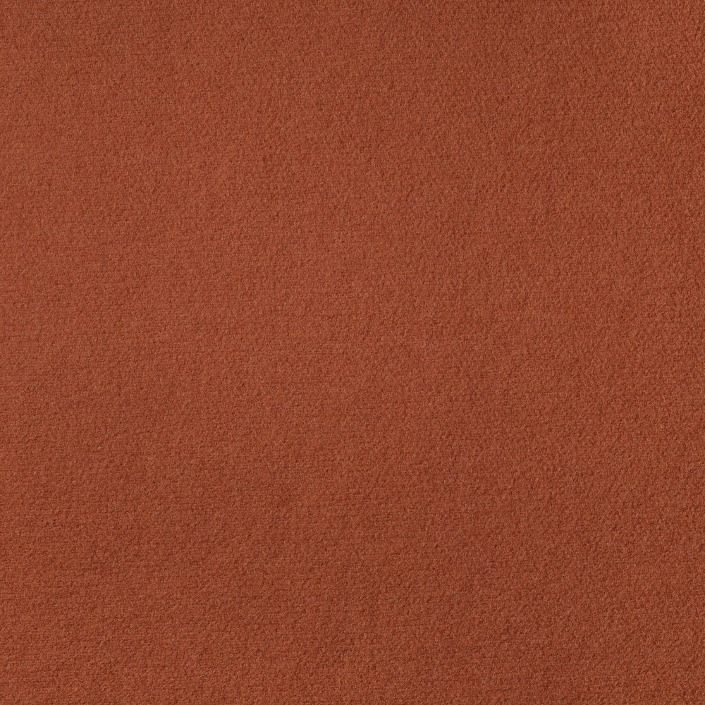 Close-up of warm burnt-terracotta Zucca fabric with a finely mottled matte weave