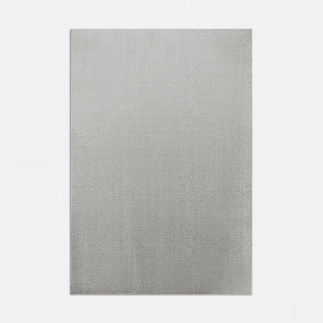 Cool silver-grey fabric with subtle vertical weave and softly mottled texture