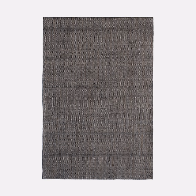 Charcoal-grey Picolit Carbone swatch showing fine crosshatched weave and tonal vertical striations