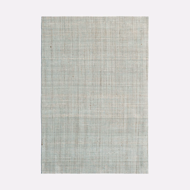 Pale celadon curtain fabric with fine intersecting slub lines and a cool grey cast