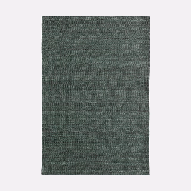 Deep forest-green woven swatch with fine striations and softly irregular texture