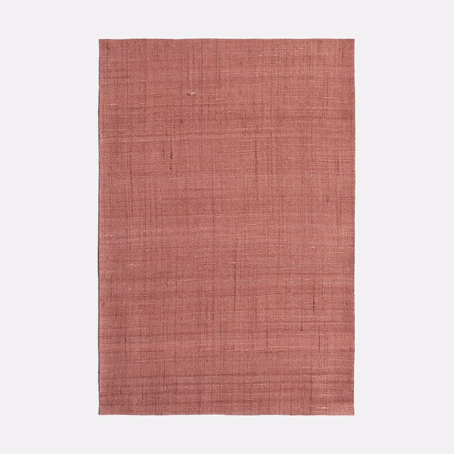 Muted paprika-red woven swatch with subtle crosshatch texture and tonal variation