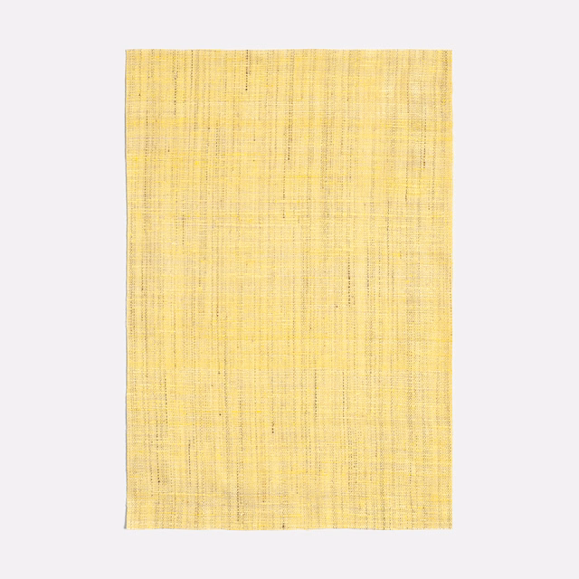 Pale straw-yellow woven curtain fabric with fine vertical striations and subtle slub texture
