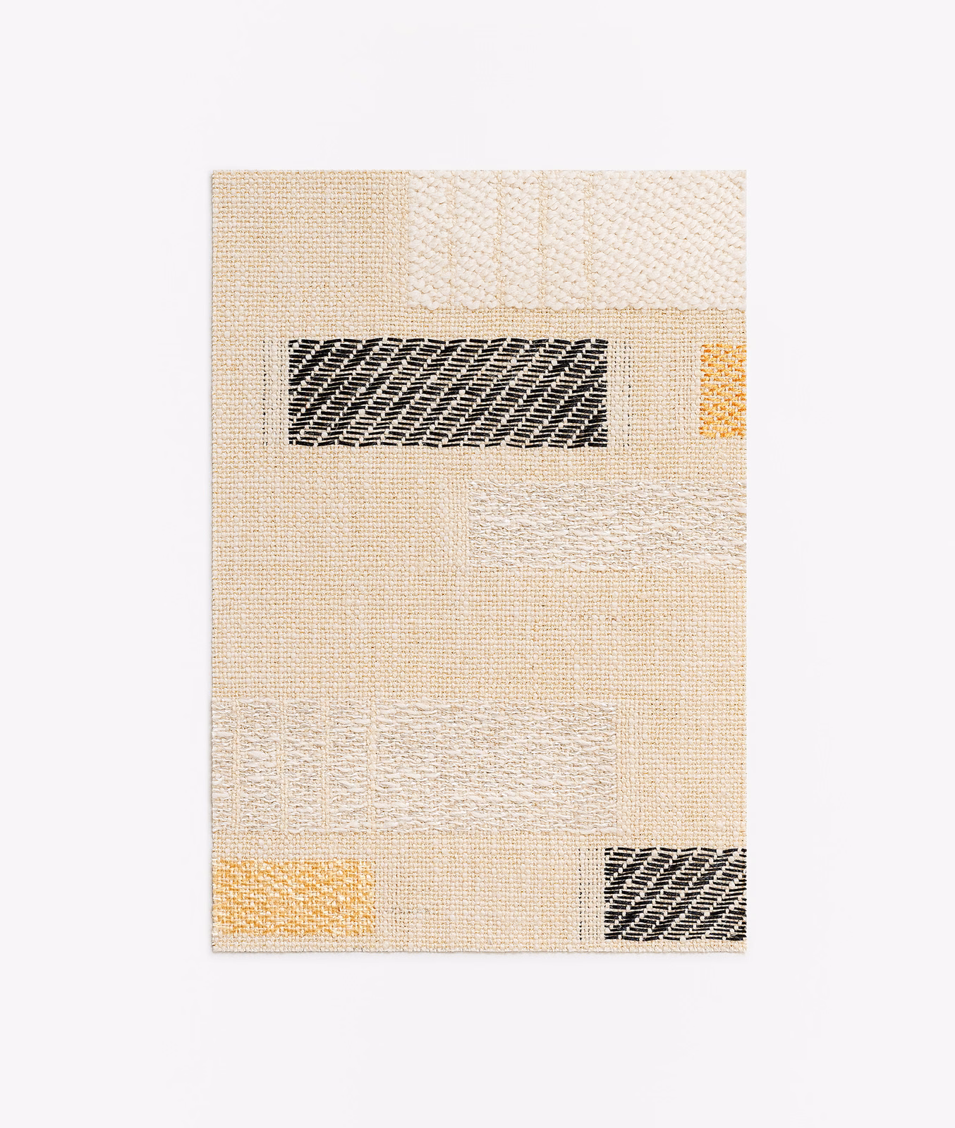 Warm ivory woven swatch with black and ochre geometric inset blocks