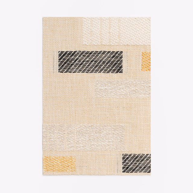Warm ivory woven swatch with black and ochre geometric inset blocks