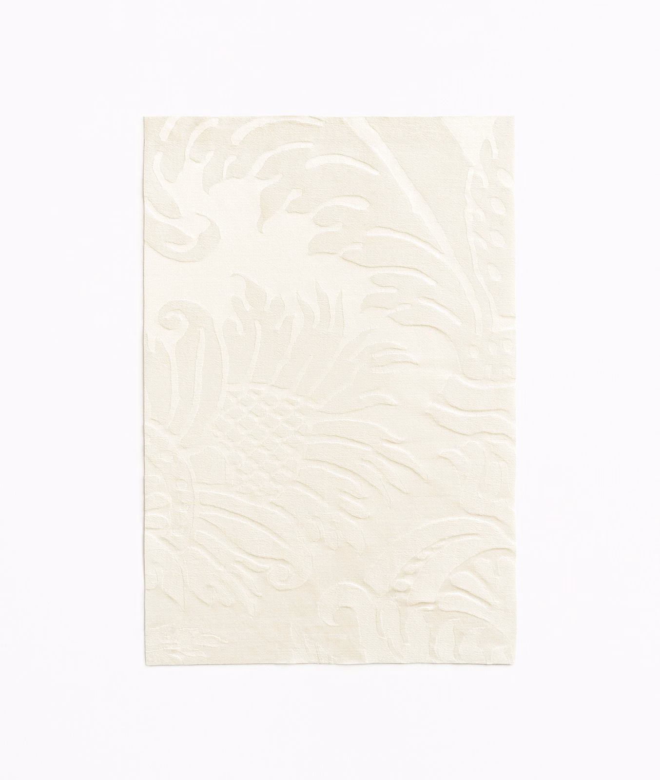 Ivory cream swatch with a raised, flowing tone-on-tone damask pattern