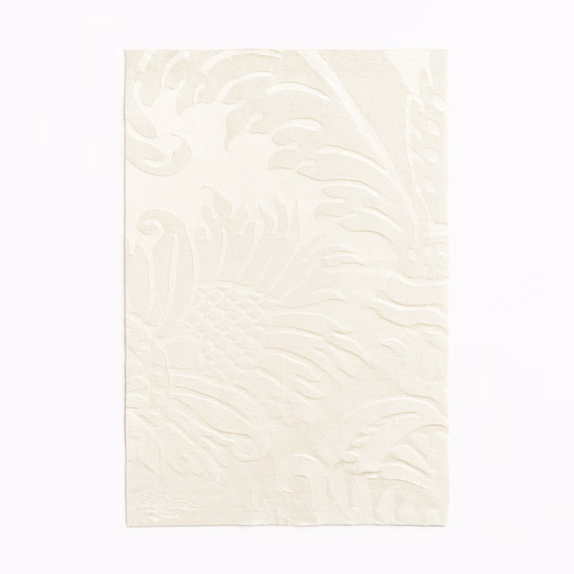 Ivory cream swatch with a raised, flowing tone-on-tone damask pattern