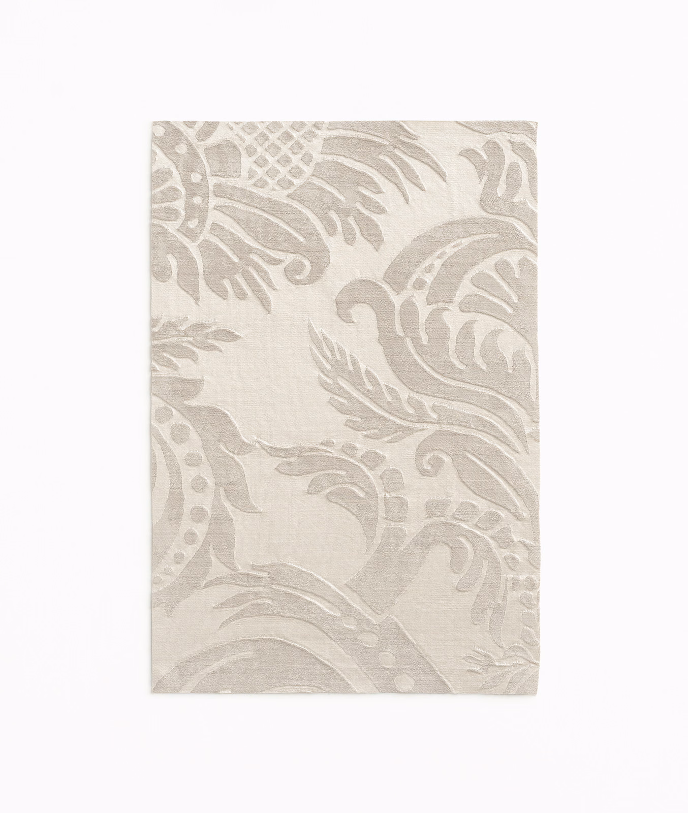 Pale taupe damask swatch with softly raised scrolling motifs and a linen-like texture