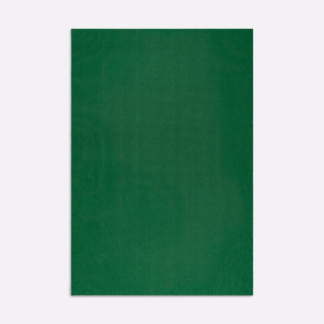 Deep emerald green curtain fabric with a subtle vertical woven texture