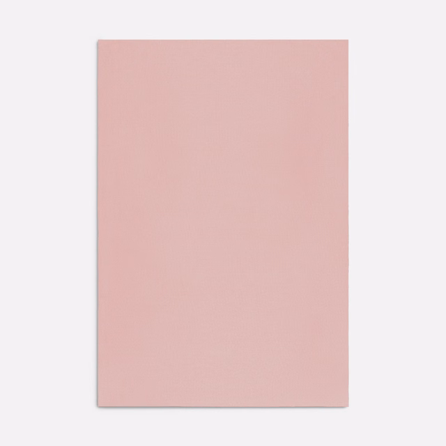 Dusty blush-pink plain fabric with a soft, subtly textured surface
