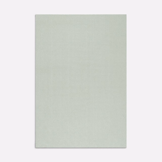 Pale sage green Rapunzel Metallo fabric swatch with a subtle fine woven texture