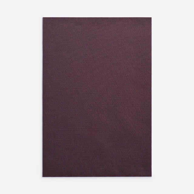 Deep plum-burgundy curtain fabric with a subtle, closely woven surface