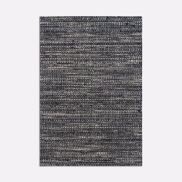 Charcoal ebony woven swatch with fine pale flecks and irregular horizontal texture