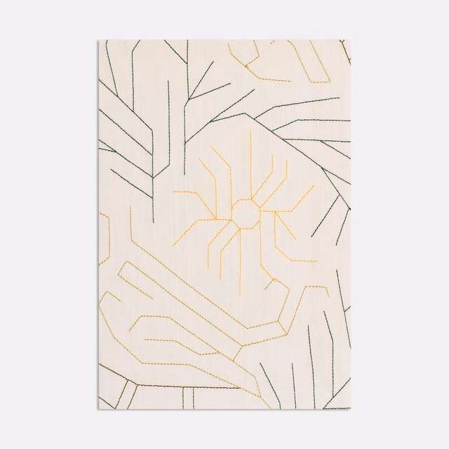 Warm ivory Dedar fabric with charcoal and pale-gold angular abstract linework