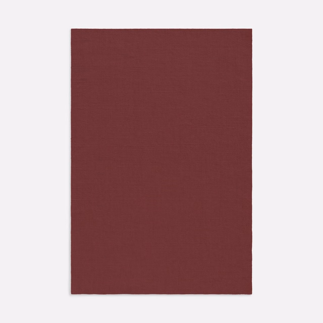 Deep burgundy Salicornia fabric showing a fine, subtly crosshatched plain weave