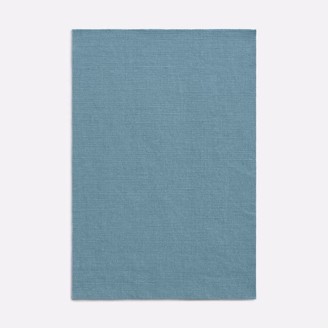 Muted blue-teal curtain fabric swatch with a fine, closely woven surface