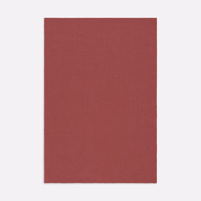 Muted Bordeaux red curtain fabric with a fine, subtly slubbed woven surface