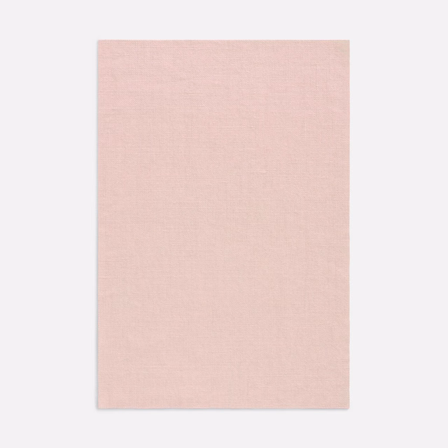 Pale blush-pink Salicornia fabric showing a fine, softly crosshatched woven surface