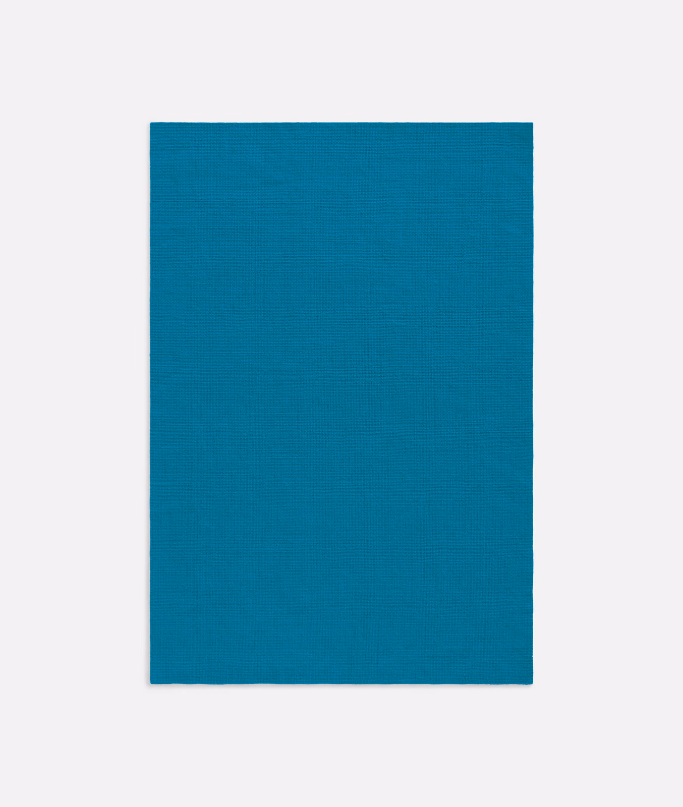 Saturated teal-blue cloth with a fine, subtly irregular woven texture