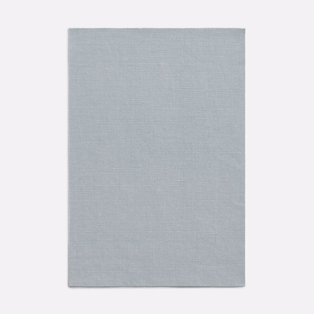 Pale blue-grey curtain fabric with a fine, subtly crosshatched woven texture