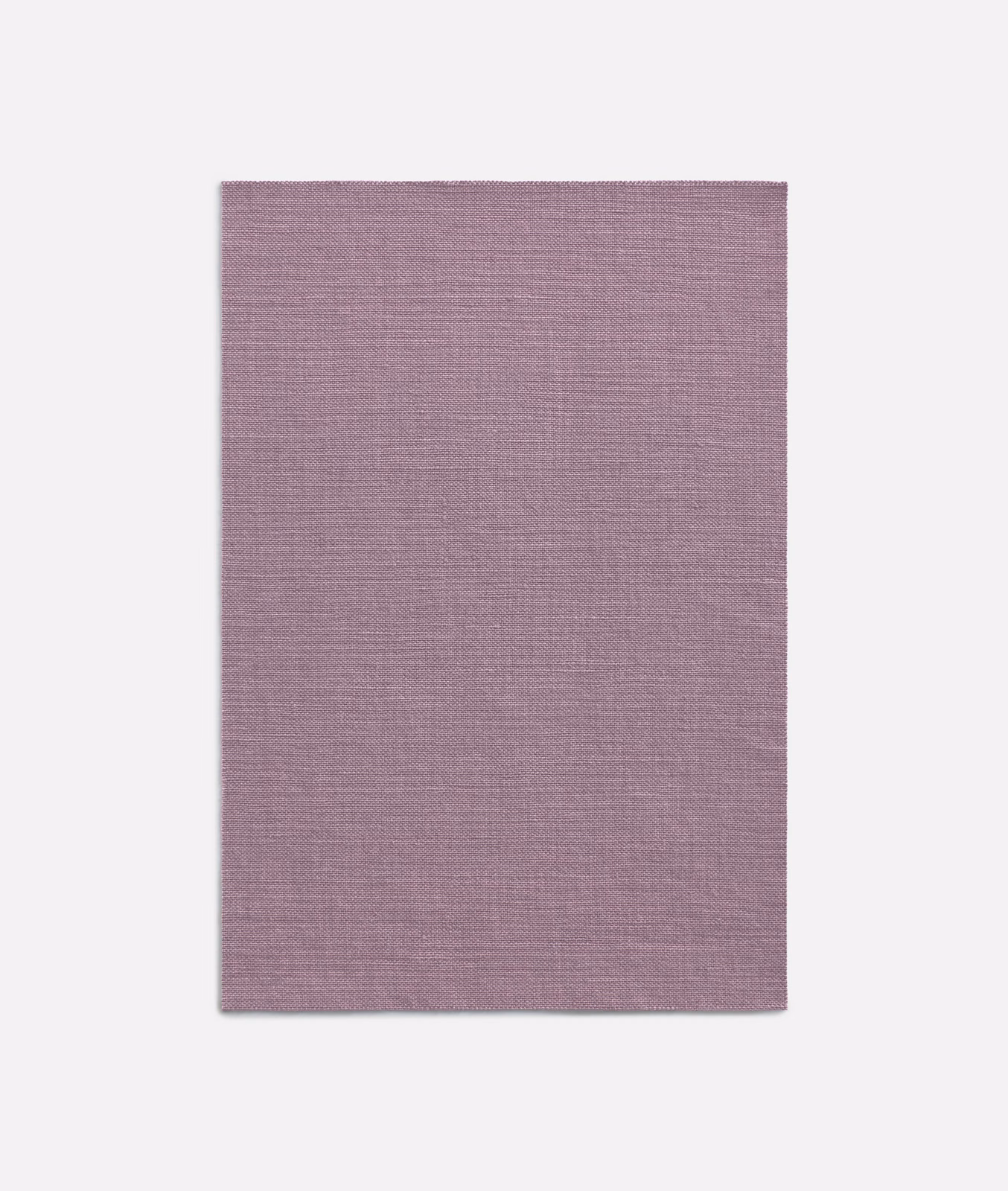 Muted lilac-mauve curtain fabric with a fine, subtly crosshatched woven texture