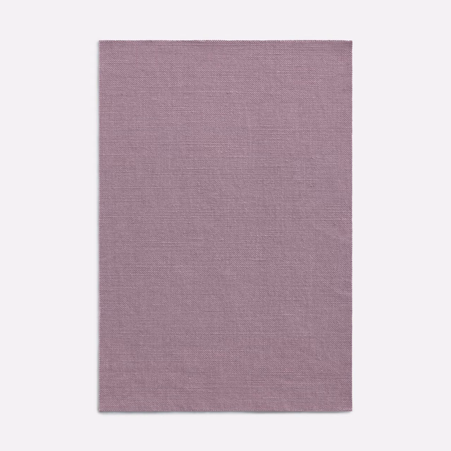 Muted lilac-mauve curtain fabric with a fine, subtly crosshatched woven texture