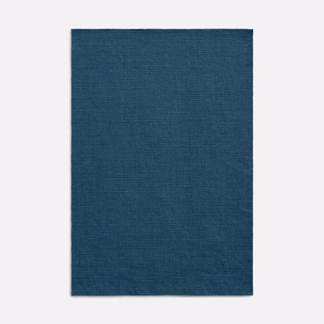 Deep navy-blue textile swatch with a subtle blue-green crosshatch weave
