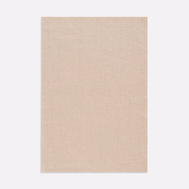 Pale nude-beige swatch showing a fine, subtly variegated plain weave