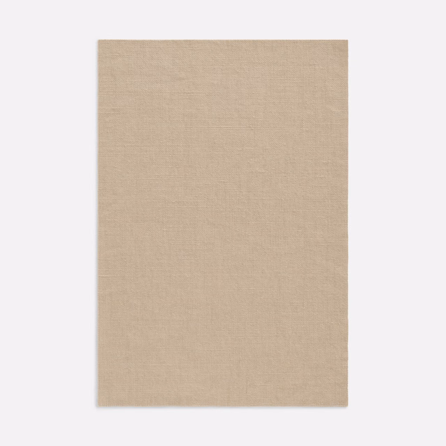Warm sandy beige curtain fabric with a fine, subtly irregular woven texture