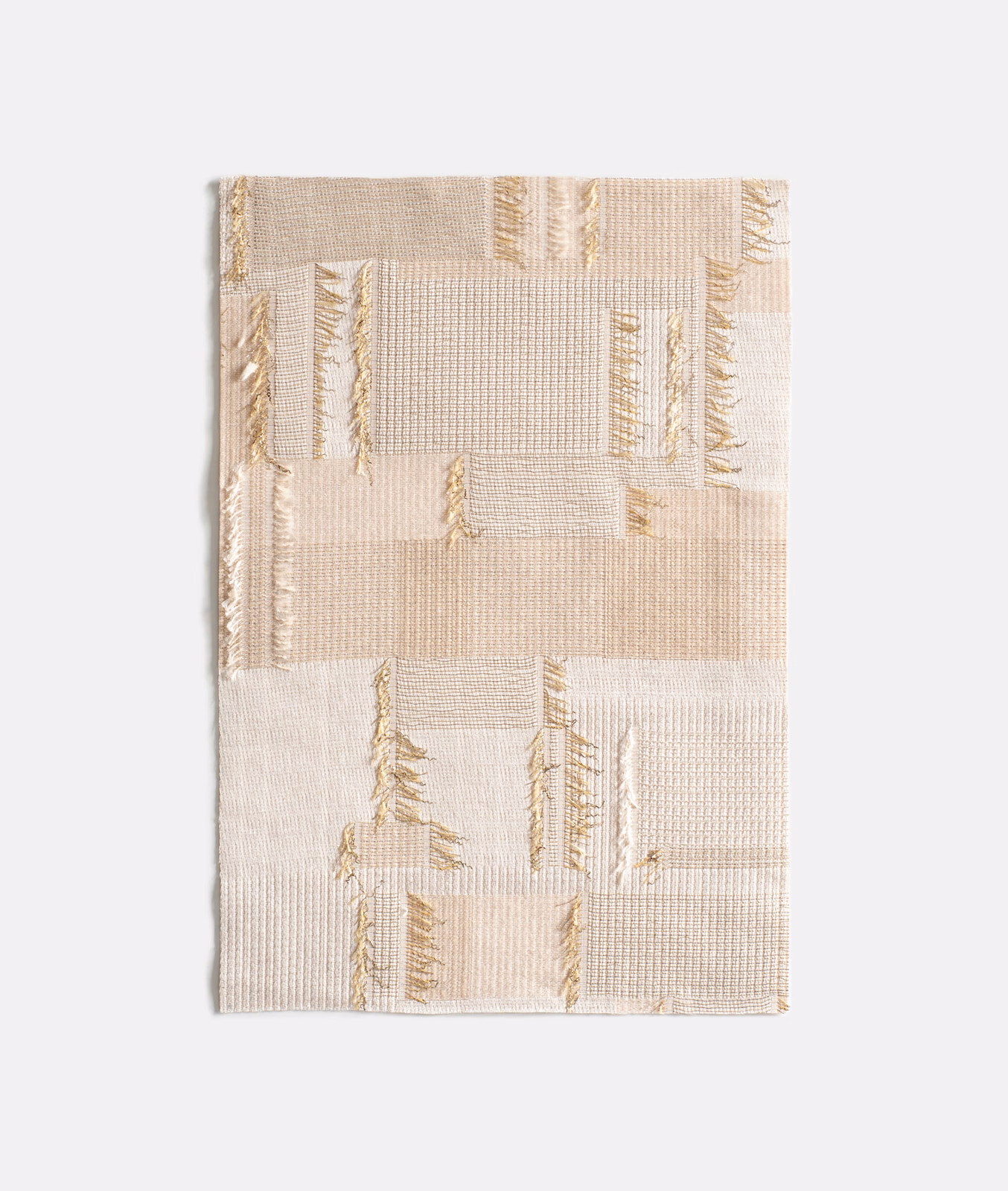 Ivory woven curtain fabric with pale beige blocks and delicate gold linear accents