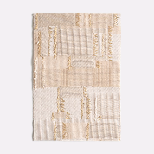 Ivory woven curtain fabric with pale beige blocks and delicate gold linear accents