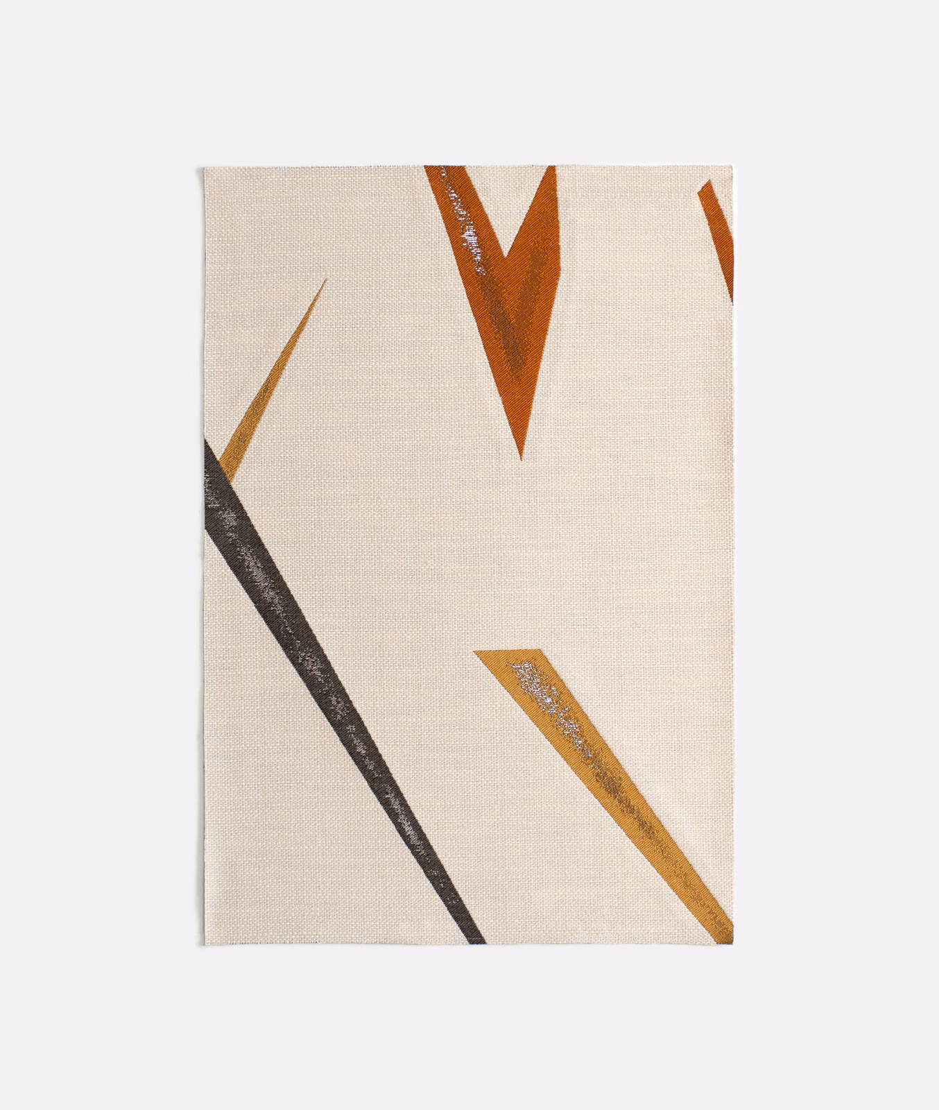 Warm cream textile with charcoal, rust and ochre angular brush marks