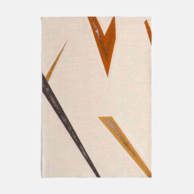 Warm cream textile with charcoal, rust and ochre angular brush marks